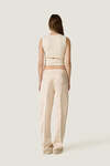Beige top with a modern waist cut-out - SS26